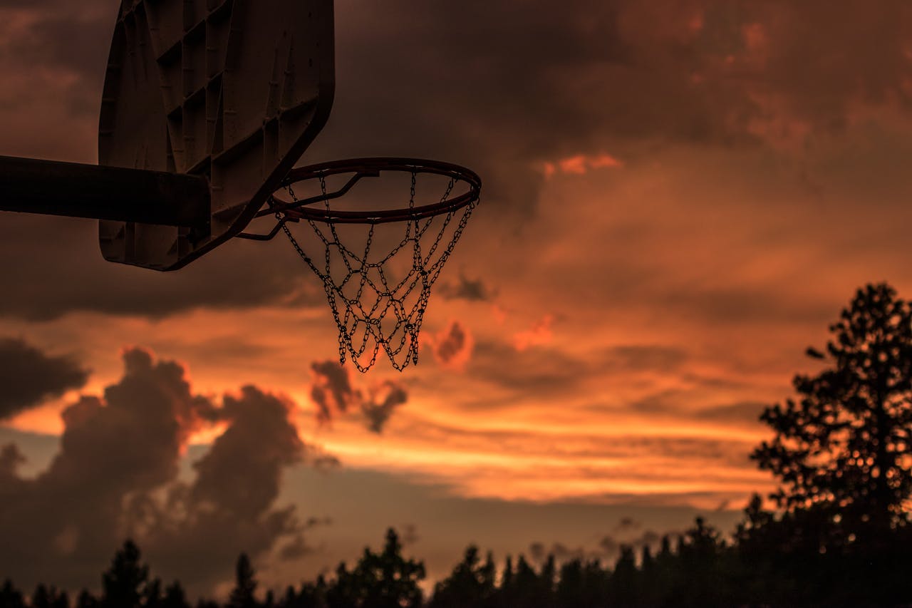 our-services-2 Silhouette of a basketball hoop with vibrant sunset sky in Truckee, CA.